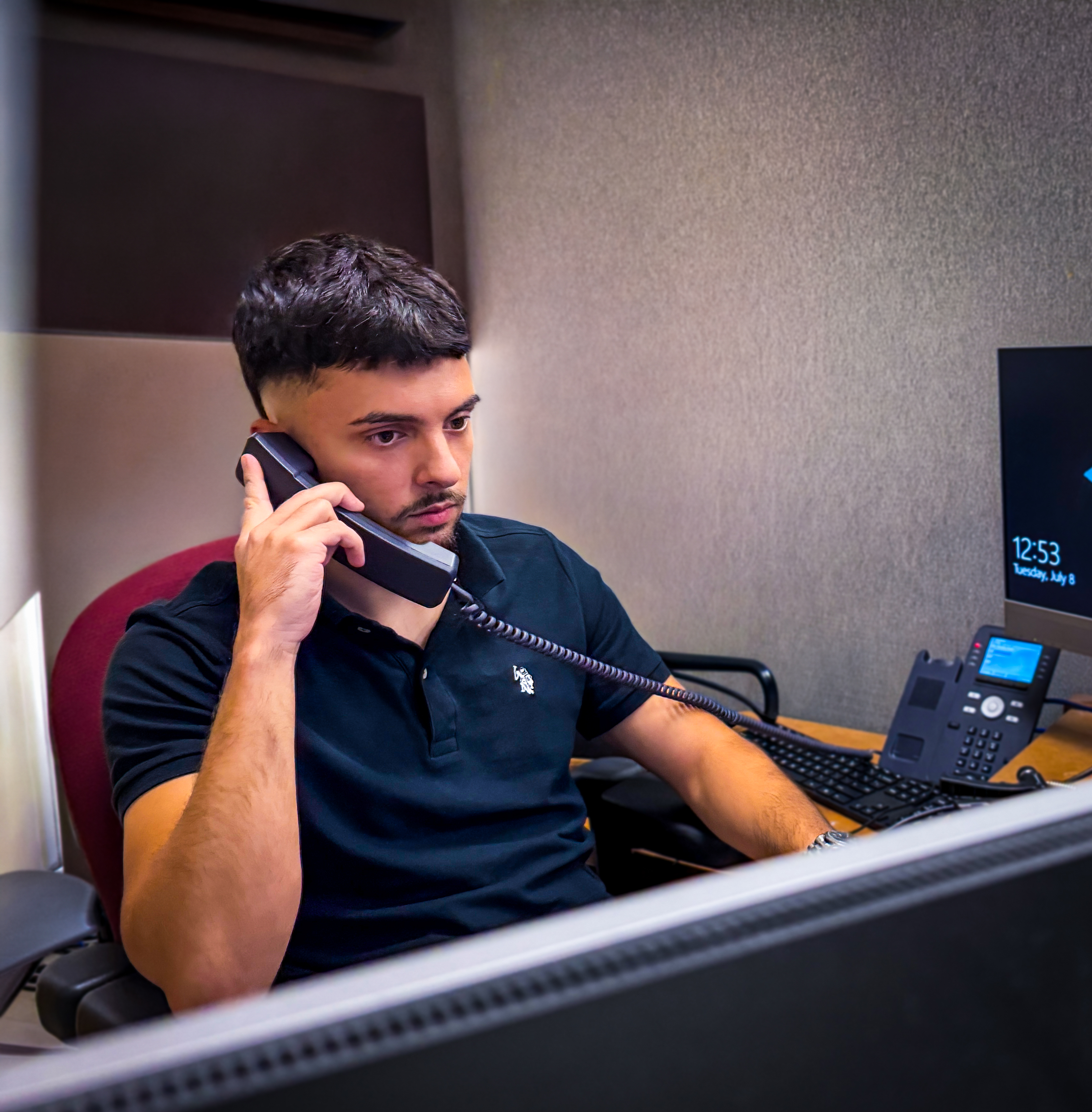 Alen Kurtish, founder of Alveris IT LLC, at his workstation
